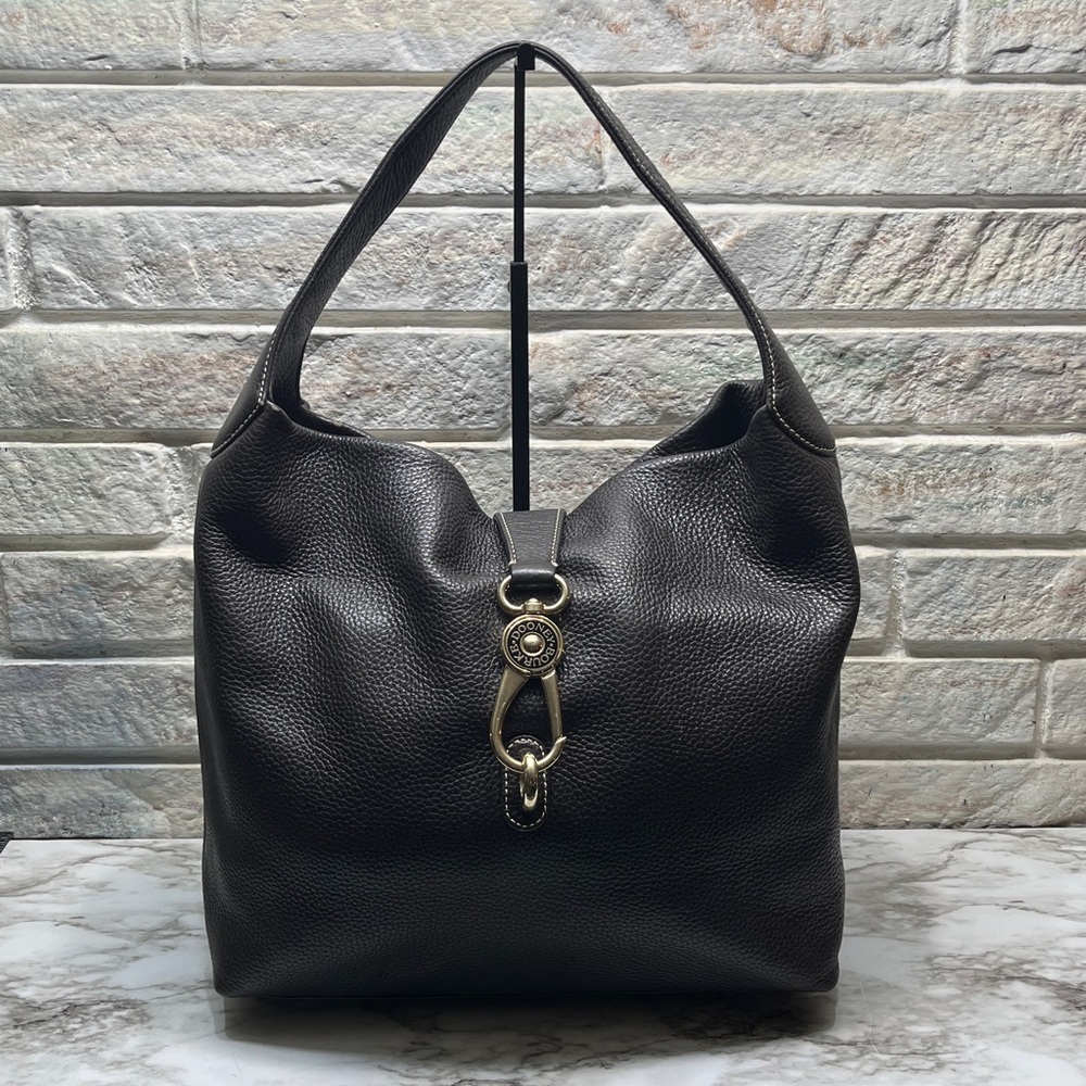 Dooney & Bourke Belvedere Logo Lock shoulder bag in black pebbled leather. W/COA